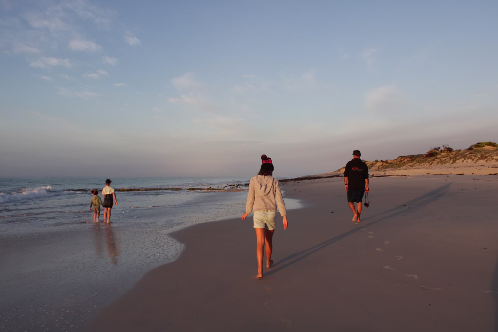 Person walking along a New Zealand beach